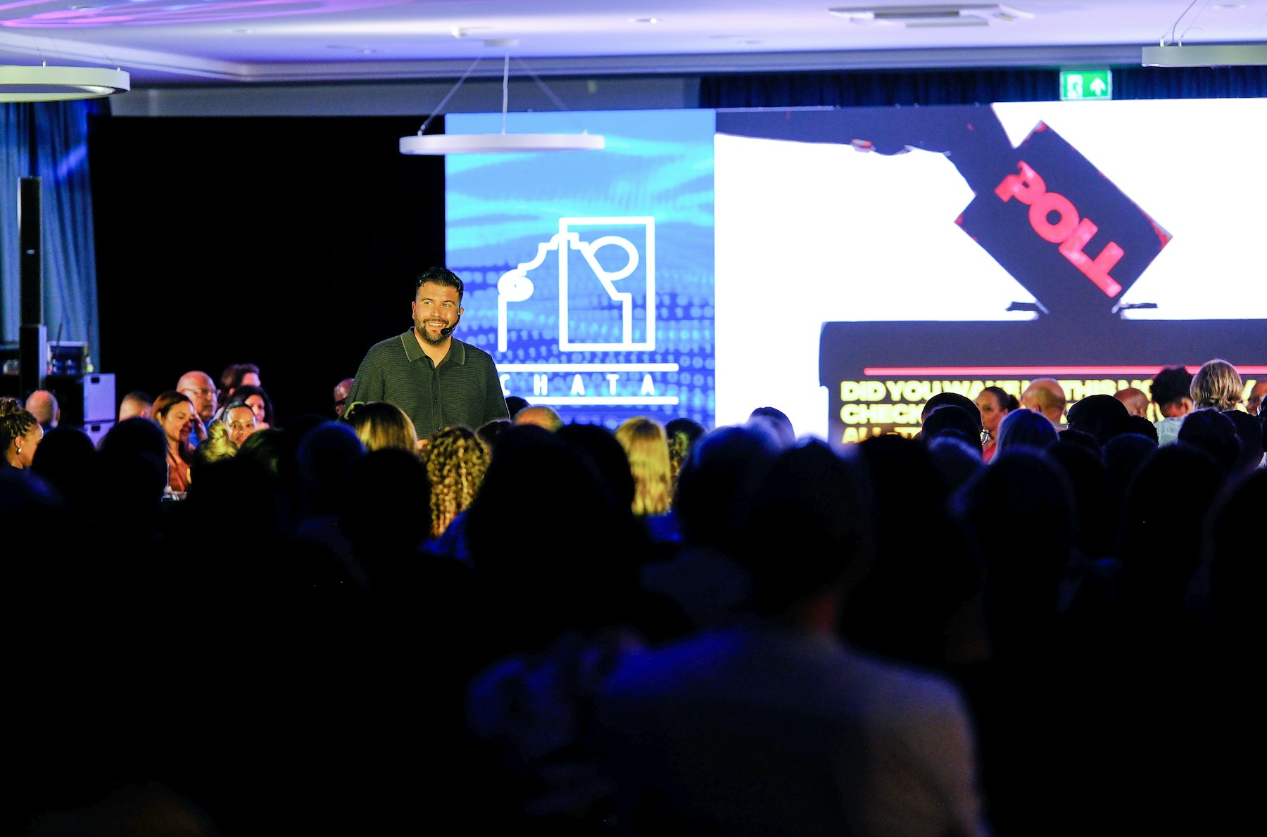 Speaker presenting on a conference stage